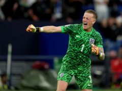 England goalkeeper Jordan Pickford celebrates after the Euro 2024 win over Slovakia. (Martin Rickett/PA)