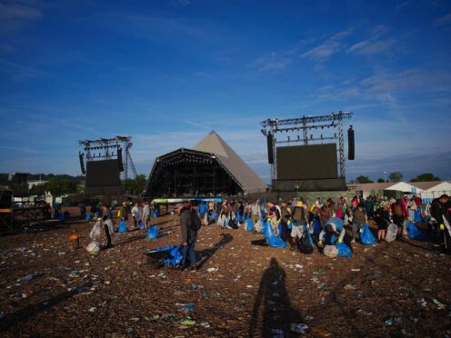 Litter and rubbish being pickup at the end of the Glastonbury Festival at Worthy Farm in Somerset (Ben Birchall/PA)