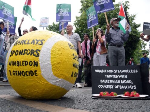 People protesting against Barclays sponsorship of the Wimbledon Championships (Jordan Pettitt/PA)