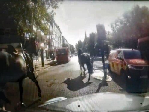 Dashcam footage of two of three military horses which bolted through central London on Monday morning (@Davenoisome/PA)