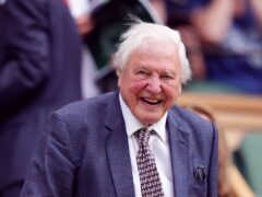 Sir David Attenborough appeared in good spirits as he arrived in the royal box on Centre Court on the first day of Wimbledon (John Walton/PA)