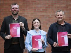 (left to right) Gerry Carroll, Westminster parliamentary candidate for West Belfast, and Fiona Ferguson, Westminster parliamentary candidate for Belfast North, with Richard Boyd Barrett TD holding copies of the People Before profit General Election manifesto launch at The Mac Belfast. Picture date: Monday July 1, 2024.