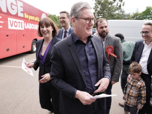 Labour leader Sir Keir Starmer and shadow chancellor Rachel Reeves arrive for a visit to Heath Farm in Chipping Norton, while on the General Election campaign trail (Stefan Rousseau/PA)