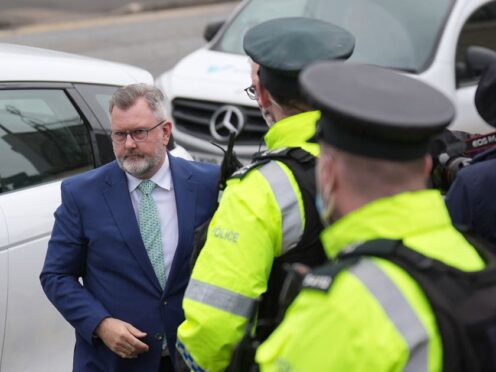 Former DUP leader Sir Jeffrey Donaldson (left) arrives at Newry Magistrates’ Court (Niall Carson/PA)