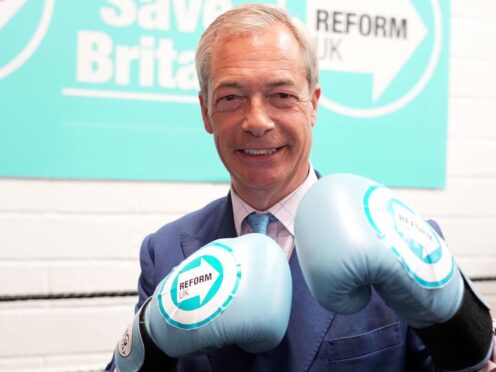 Reform UK leader Nigel Farage wearing boxing gloves at a boxing gym in Clacton (Ian West/PA)