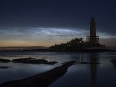 Noctilucent clouds or night clouds over St Mary’s Lighthouse in Whitley Bay, North Tyneside (Owen Humphreys/PA)