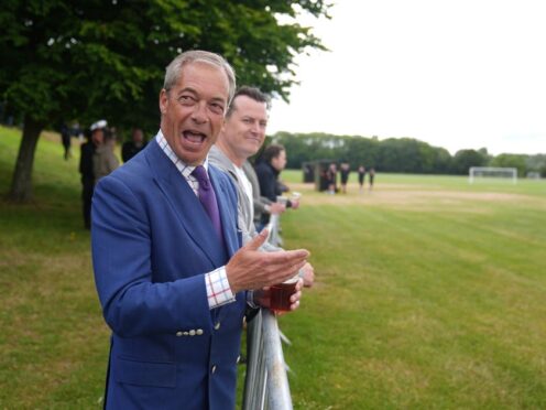 Reform UK leader Nigel Farage and the new Reform MP for South Basildon and East Thurrock, James McMurdock, watch the inaugural match of East Thurrock CFC at Wyldecrest Sports Country Club, Corringham, Essex. Picture date: Saturday July 6, 2024. (Joe Giddens/PA)