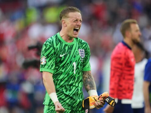 England goalkeeper Jordan Pickford celebrates after the penalty shoot-out win over Switzerland (Adam Davy/PA)