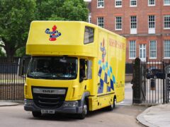 A yellow removal van was spotted at the back of Downing Street, with workers steadily loading it up with items (James Manning/PA)