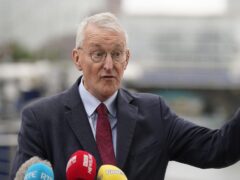 Northern Ireland Secretary Hilary Benn speaks to the media outside Waterfront Hall during a visit to Belfast (Niall Carson/PA)