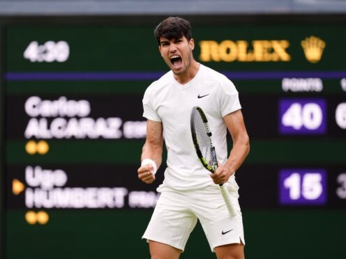 Carlos Alcaraz was pushed hard by Ugo Humbert during a four-set win on Centre Court (John Walton/PA)