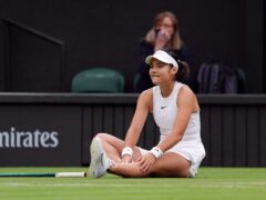 Emma Raducanu took a tumble during her match with Lulu Sun and eventually crashed out of Wimbledon in the fourth round (John Walton/PA)