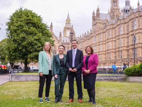 The party’s four new MPs gathered outside the Houses of Parliament (Ian West/PA)