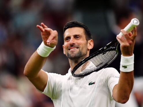 Novak Djokovic pretends to play a violin after beating Holger Rune (Mike Egerton/PA)