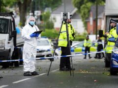 Police and forensics officers at the scene of a fatal shooting in Walsall (Jacob King/PA)