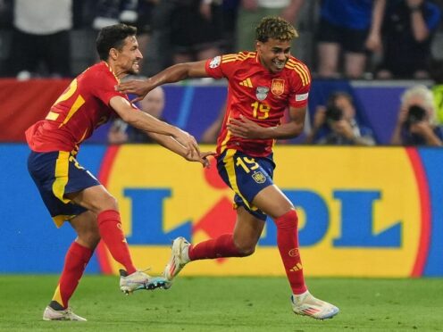Spain’s Lamine Yamal, right, celebrates after becoming the youngest scorer in European Championship history (Bradley Collyer/PA)