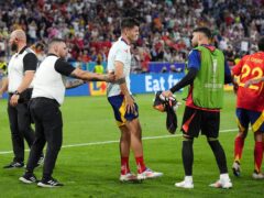 Spain captain Alvaro Morata, centre, reacts after being involved in a collision with stadium security following their Euro 2024 semi-final victory over France (Bradley Collyer/PA)