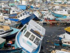 Fishing vessels damaged by Hurricane Beryl sit upended at the Bridgetown Fisheries in Barbados (Ricardo Mazalan/AP))
