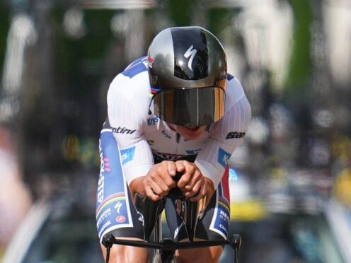 Remco Evenepoel took his first Tour de France victory in stage seven’s time trial (Daniel Cole/AP)