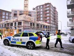Swedish police arrive at the site where a construction elevator crashed to the ground on a building site seriously injuring several people in Sundbyberg, north of Stockholm, Sweden (Claudio Bresciani/TT News Agency via AP, File)