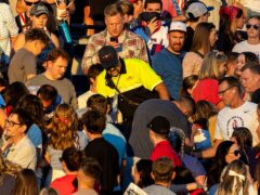 The crowd watches as a firefighter searches for an injured individual after an errant firework exploded among attendees during Stadium of Fire held at LaVell Edwards Stadium in Provo, Utah (Isaac Hale/AP)