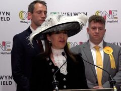 Returning officer Annie Brewster donned a large brimmed hat to declare the result for Welwyn Hatfield (Elena Giuliano/PA)