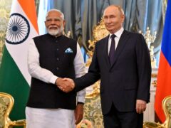 Russian President Vladimir Putin and Indian Prime Minister Narendra Modi shake hands (Alexander Nemenov/Pool Photo via AP)
