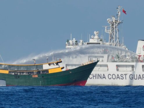 Philippine resupply vessel Unaizah May 4 is hit by Chinese coast guard water canon blast causing injuries to multiple crew members as they tried to enter the Second Thomas Shoal (Aaron Favila/AP)