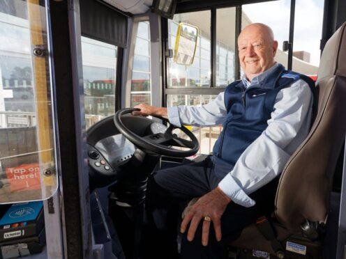 A man believed to be the UK’s longest serving bus driver has vowed to stay behind the wheel (First Bus/PA)