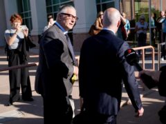 Alec Baldwin, left, arrives with one of his lawyers for jury selection in Santa Fe (AP Photo/Ross D. Franklin/PA)
