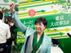 Incumbent Tokyo Governor Yuriko Koike celebrates after she was elected for Tokyo’s gubernatorial election in Tokyo on Sunday (Hiro Komae/AP)