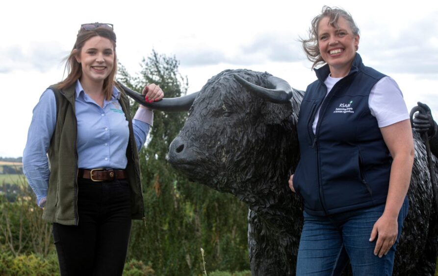 Dr MacLarty, right, outside Dingwall Mart with junior auctioneer Aimie Bisset.