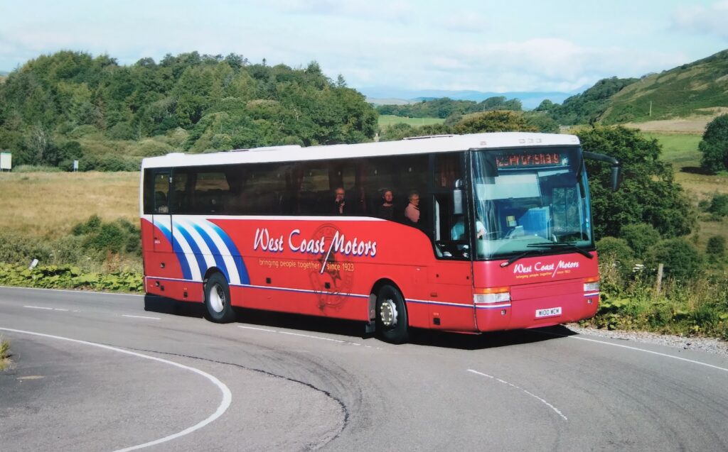 This DAF, a modernised 2000 model, served its time on the Glasgow run but latterly moved to less arduous work. It is seen here on the A816 hairpins south of Craobh Haven, while working the Oban-Ardrishaig service. The coach wears West Coast's revised livery introduced in 2003 to mark more than 80 years of service.
