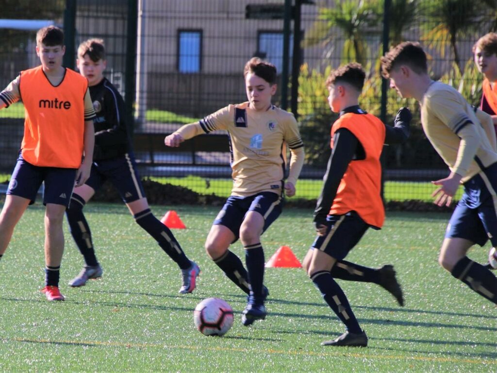 Pupils players Stuart Philips, centre, in action on Sunday.