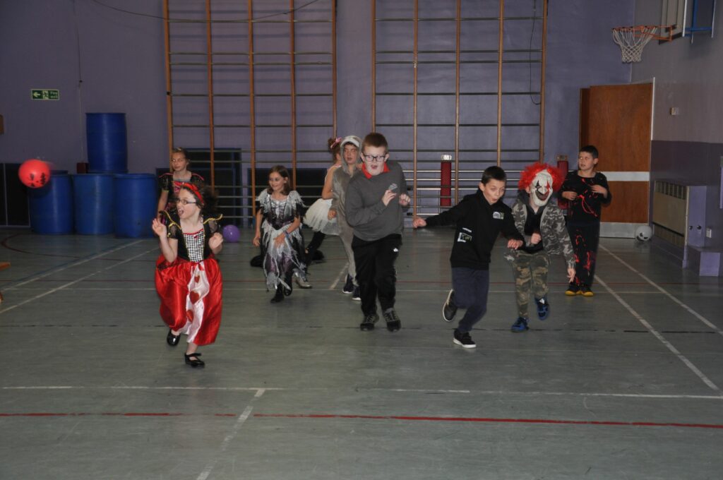 Lamlash Primary pupils excitedly dodge the pumpkin ball.