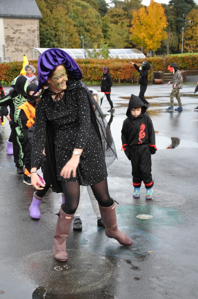 Lamlash principal teacher Lucy Marriott shares a laugh with pupils while leading the Hallowe’en parade.