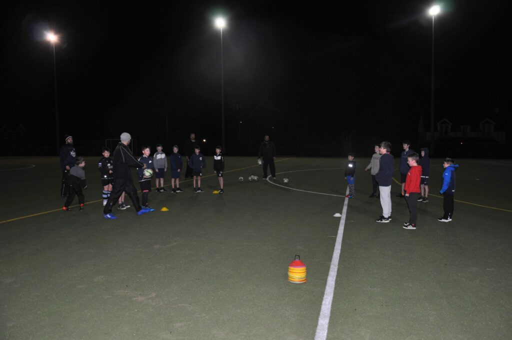 Junior rugby players receive coaching at the Ormidale Astroturf.