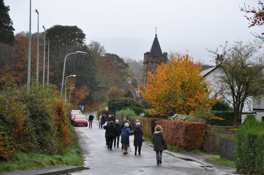 Some of the attendees make their way towards Brodick Church where a special Remembrance service was held.