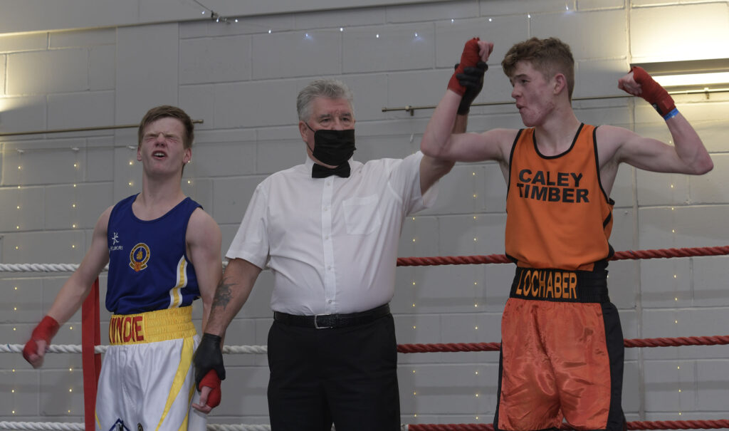 Success for Josh Dieguno as he is declared winner of his  bout against Nathan Lundie of Newarthill Boxing Club. Photograph: Iain Ferguson, alba.photosNO F46 Boxing show 09