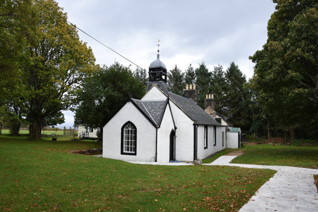 The renovated church with the manse in the background.