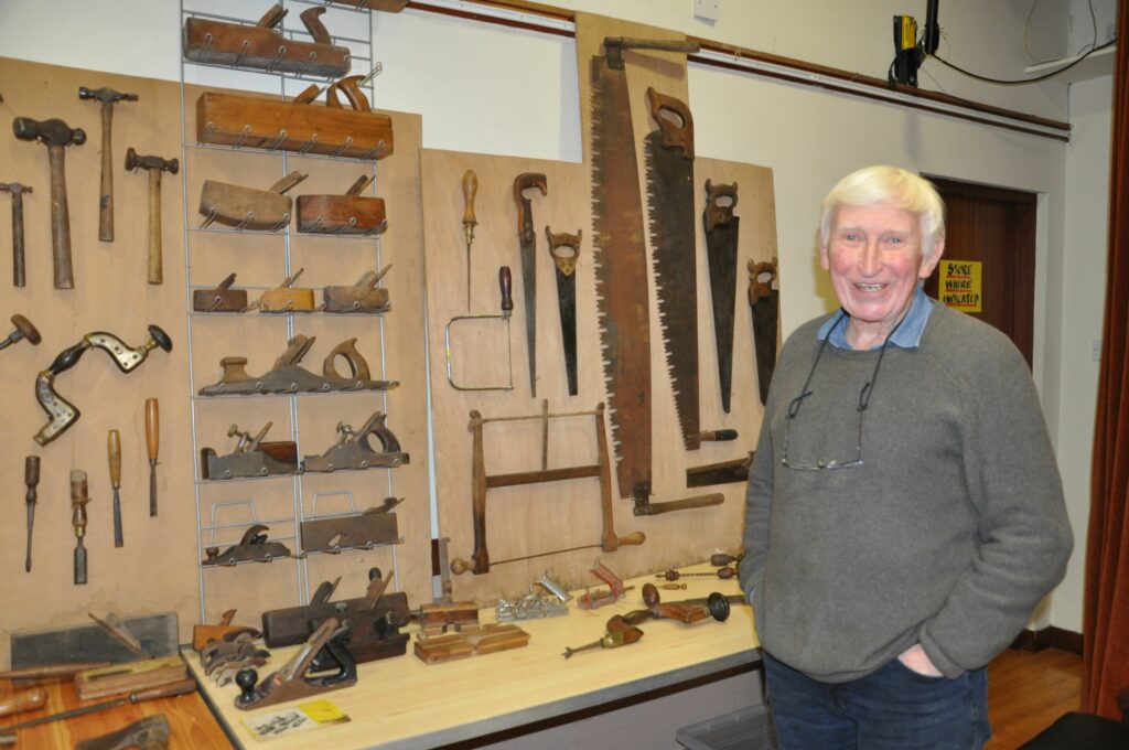 Stuart Gough with his collection of old woodworking tools.