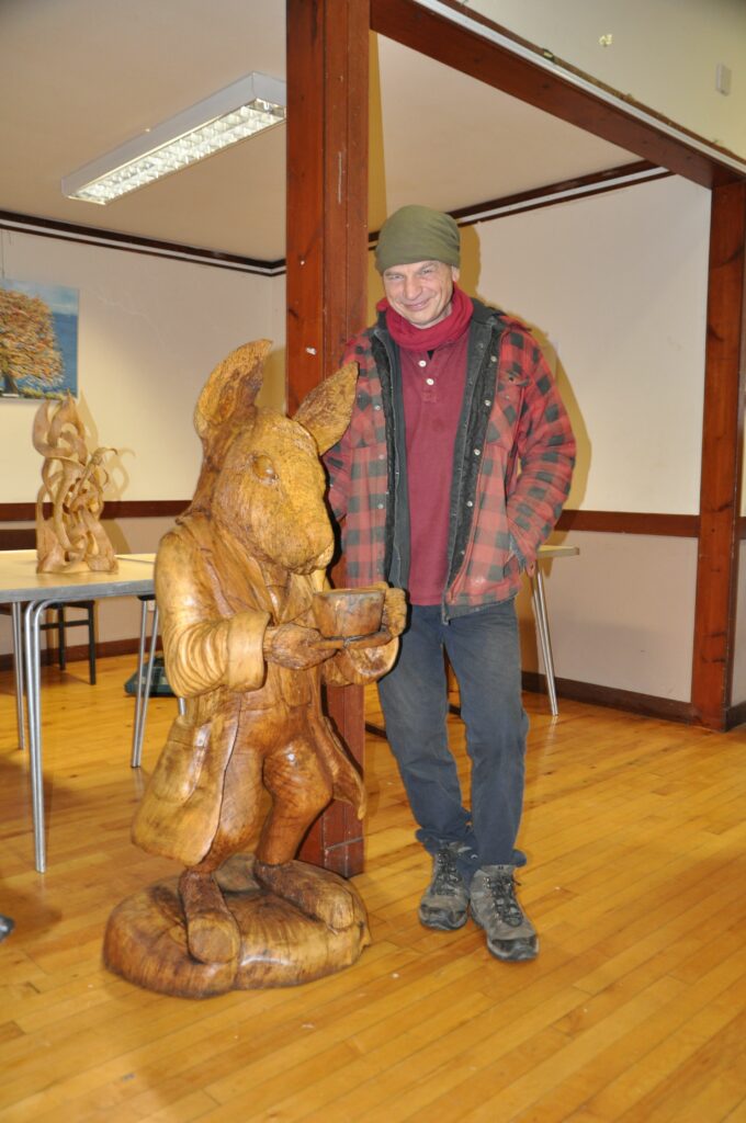 Robert Coia with one of his sculptures that never fails to draw an admiring audience.