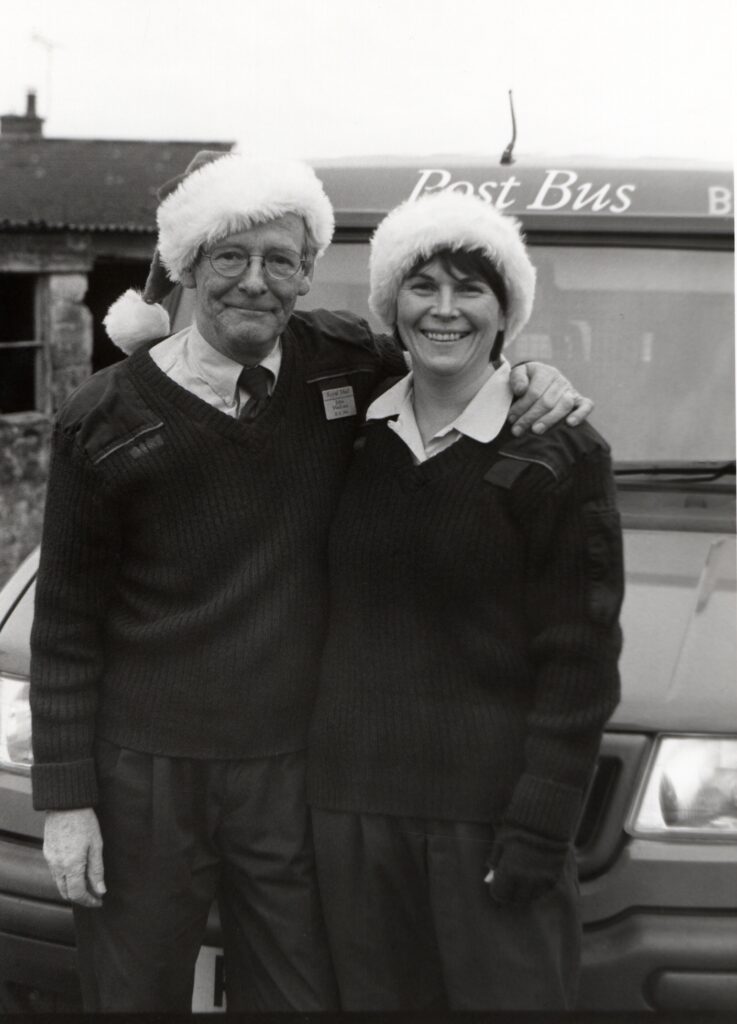 Postbus drivers John MacLure and Sandy McQueen wear Post Office issued Santa hats as they get into the festive spirit. 01_B52ABTYA05