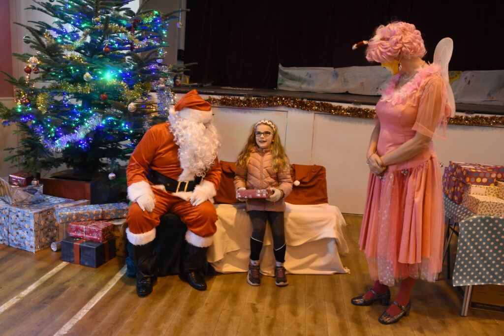 Cara McCormack tells Santa what she wants for Christmas.