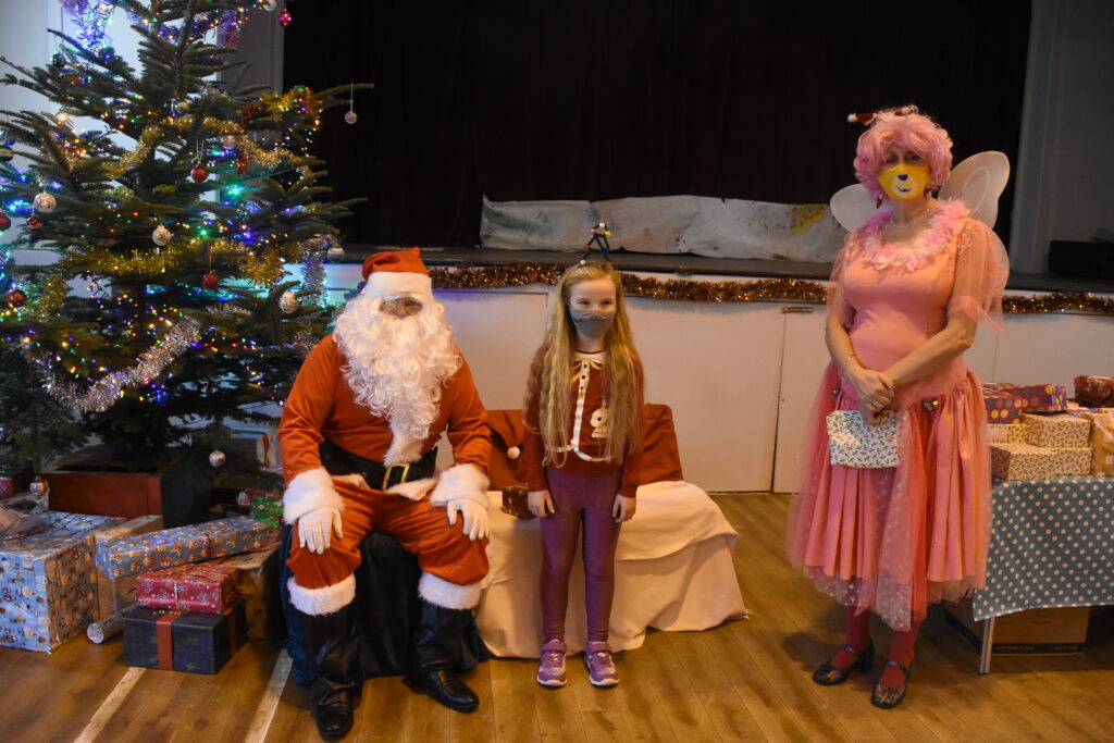 Ruby McArthur with Santa and Fairy Sheila.