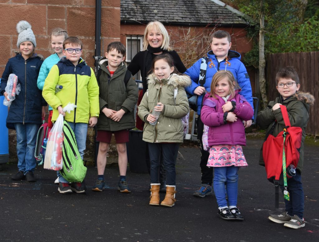 January: Mrs Lindsay Todd is surrounded by her class at Corrie Primary School as she is given a rousing send off on her retiral from teaching.
