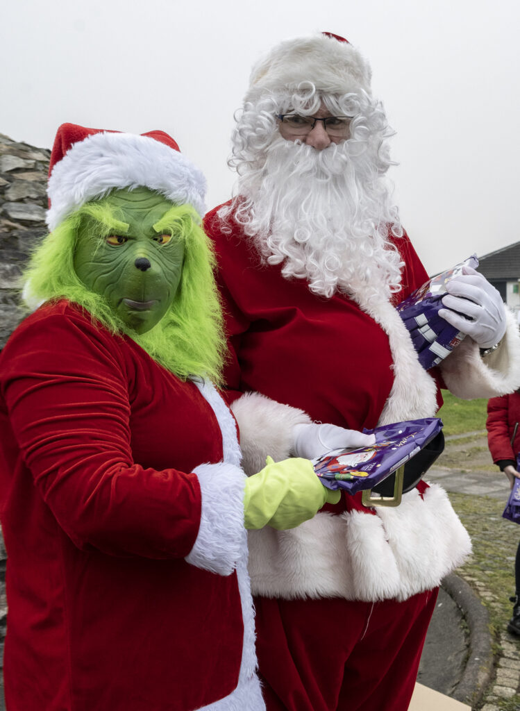 The grey, foggy skies of the weekend did not put off children in Caol from visiting Santa, but also brought out a Christmas rival, The Grinch   Photograph: Iain Ferguson, alba.photos

NO F52 SANTA IN CAOL 01
