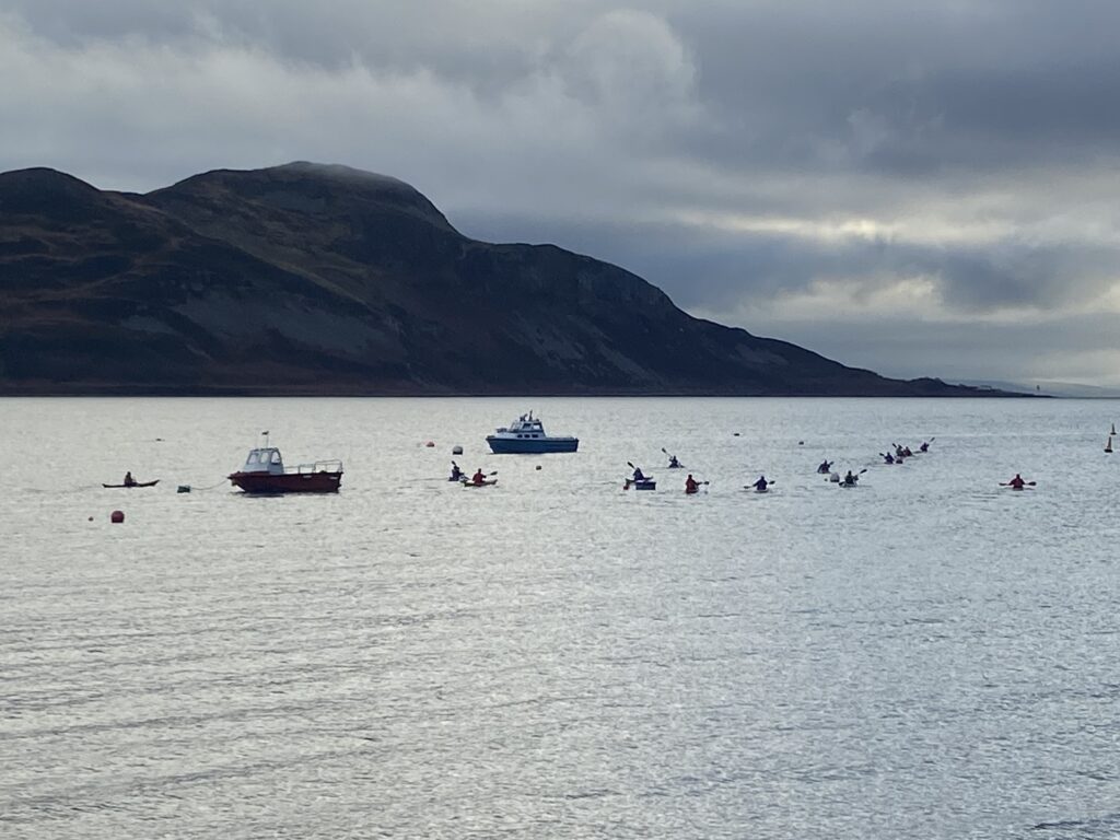 Paddlers make their way back in a relatively calm Lamlash Bay.