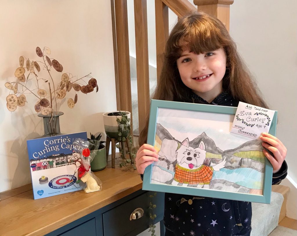 February: The winners of the annual Corrie’s Capers competition have been announced after dozens of entries were received from all over Scotland. Pictured is Eva Curley, seven, from Corriegills with her drawing of Corrie at Glen Rosa which was highly commended by the judge.