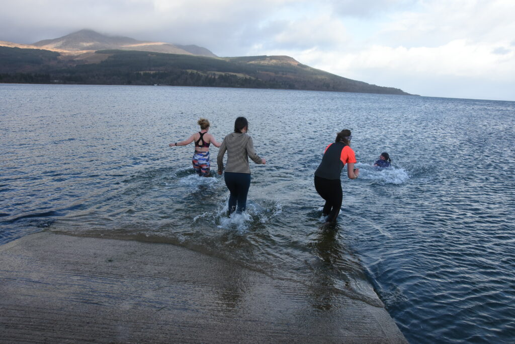 The runners gingerly take to the sea.